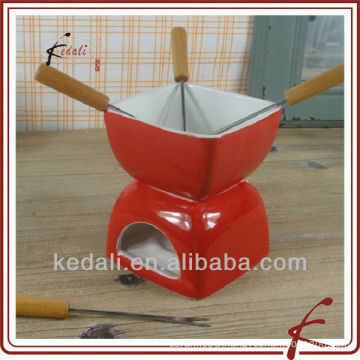 Small size red color ceramic fondue set with fork